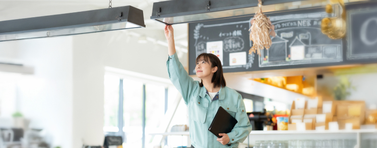 Man renting ice skates to young woman