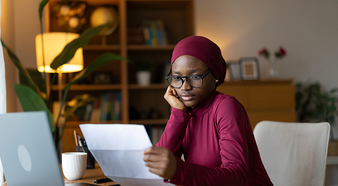 Woman looking at a bill